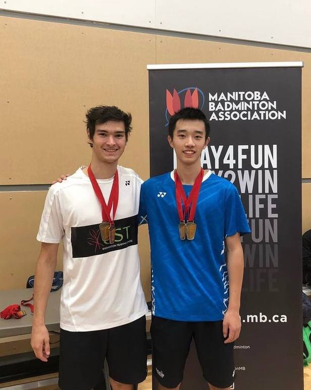 Badminton players training together during a scheduled group session