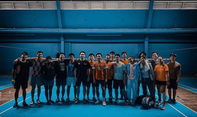 Adult badminton group training session