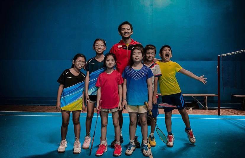 Junior badminton group training session